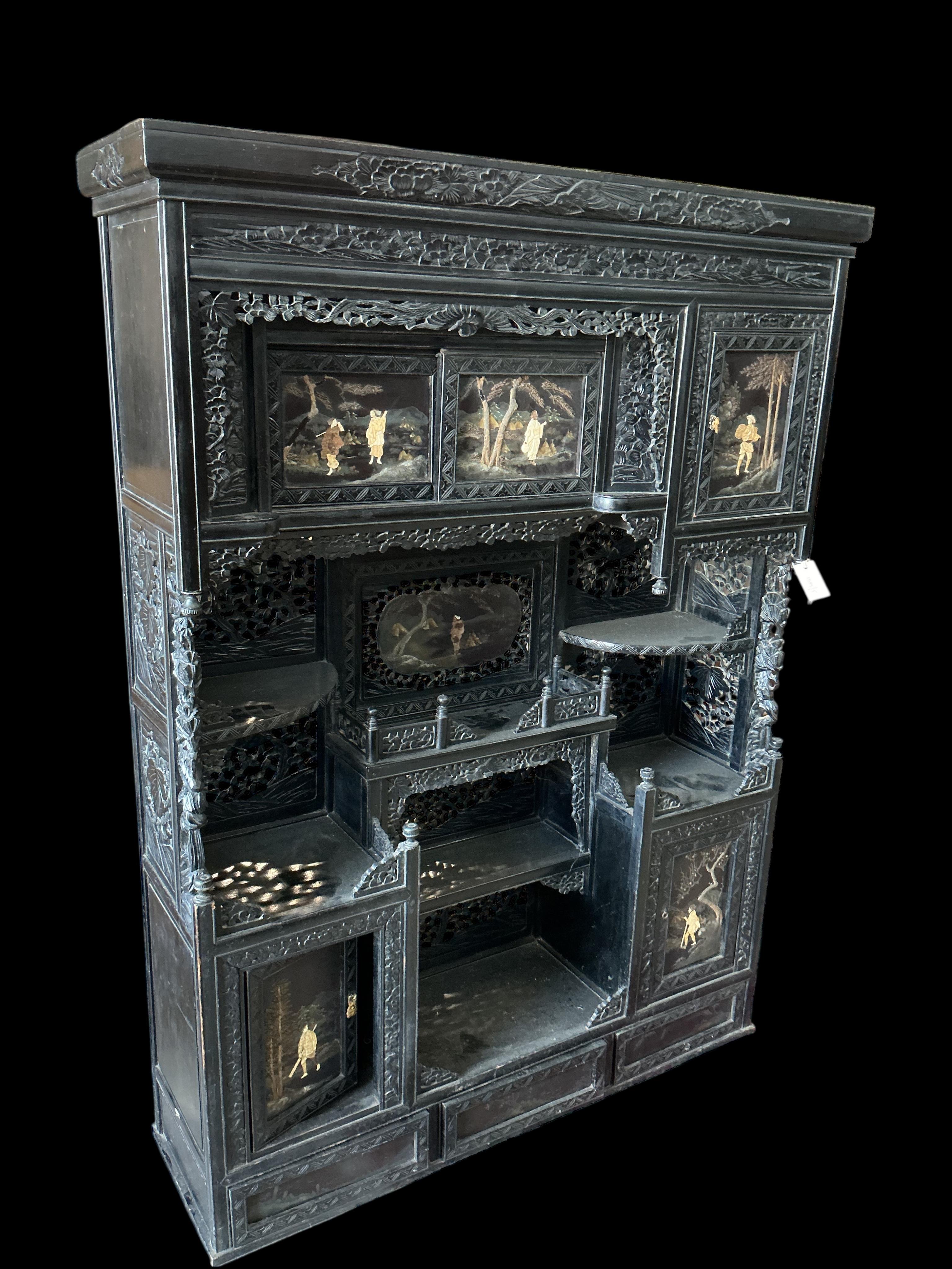 A Japanese Meiji period ebonised cabinet, width 110cm, depth 32cm, height 150cm CITES Submission reference Q4A31H9Q